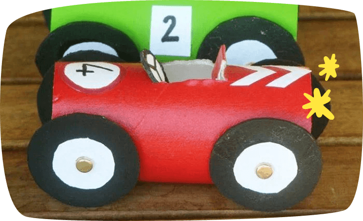 car made out of carfdboard rolls
